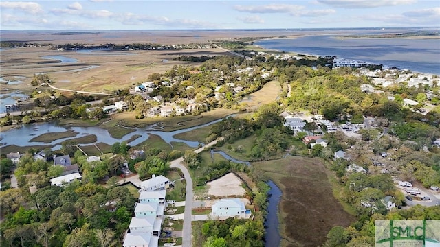 birds eye view of property with a water view and a residential view