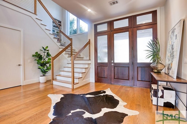 28 Delegal Rd, Savannah, GA 31411 - foyer entrance featuring baseboards, stairs, visible vents, and light wood-type flooring