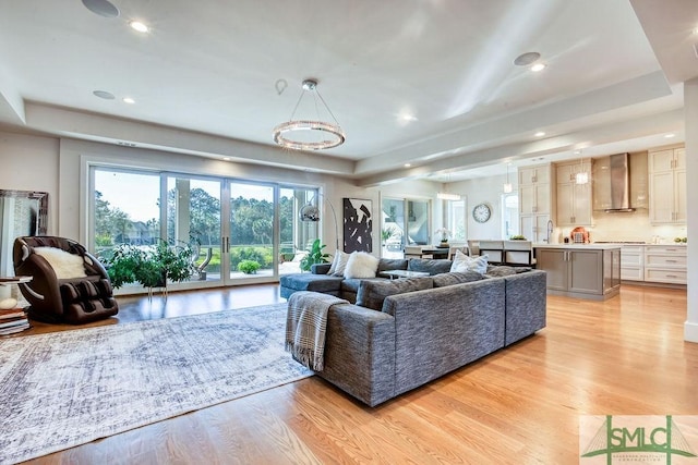 28 Delegal Rd, Savannah, GA 31411 - living area featuring a raised ceiling, recessed lighting, and light wood-type flooring