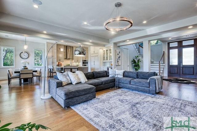 28 Delegal Rd, Savannah, GA 31411 - living room featuring french doors, light wood-style floors, stairway, and recessed lighting