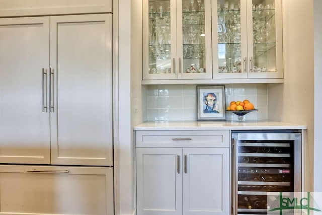 28 Delegal Rd, Savannah, GA 31411 - bar featuring backsplash, wine cooler, a dry bar, and paneled fridge