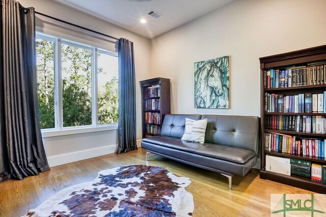 28 Delegal Rd, Savannah, GA 31411 - living area with baseboards, visible vents, wood finished floors, and plenty of natural light