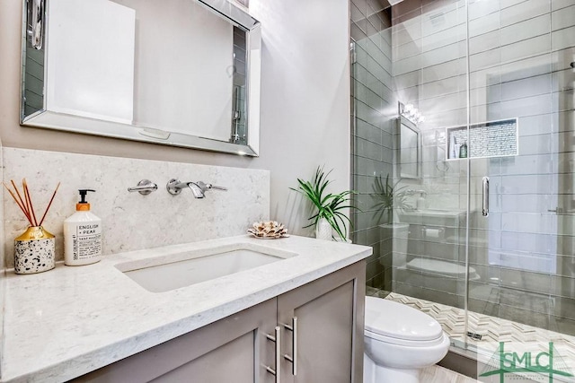28 Delegal Rd, Savannah, GA 31411 - full bath with toilet, vanity, tasteful backsplash, and a shower stall