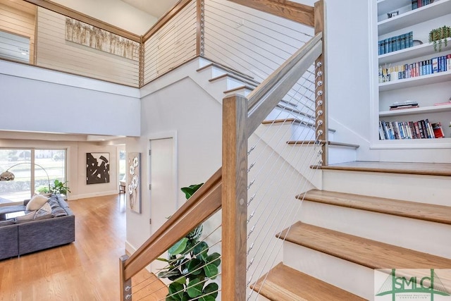 28 Delegal Rd, Savannah, GA 31411 - staircase with a high ceiling and wood finished floors
