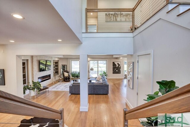 28 Delegal Rd, Savannah, GA 31411 - interior space with recessed lighting, wood finished floors, a glass covered fireplace, and built in shelves