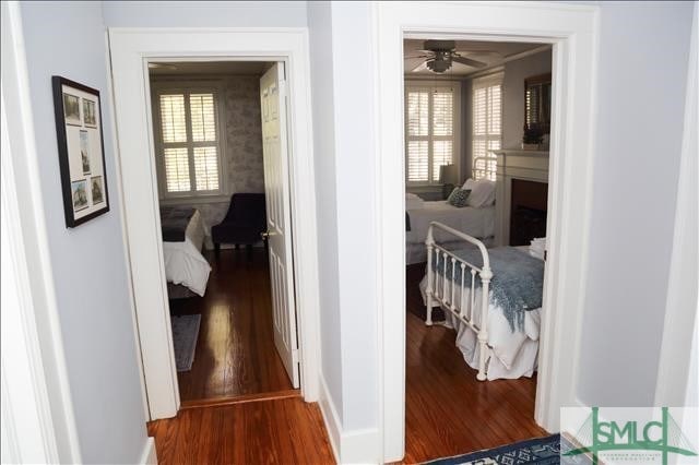 corridor featuring wood finished floors