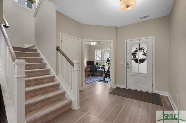 126 Canter Ct, Savannah, GA 31406 - entrance foyer featuring wood finished floors, stairway, a ceiling fan, and baseboards