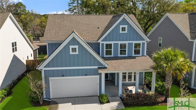 126 Canter Ct, Savannah, GA 31406 - view of front facade with board and batten siding, a shingled roof, concrete driveway, covered porch, and a garage