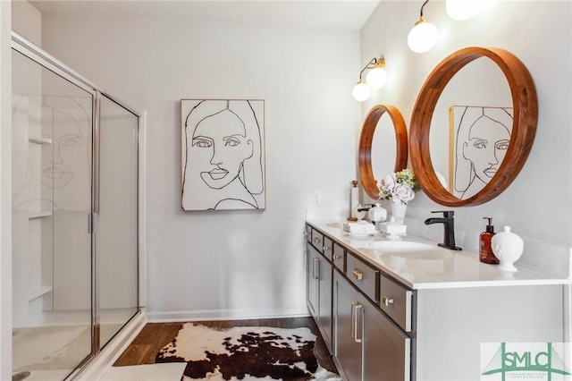 111 Troupe Dr, Savannah, GA 31407 - bathroom with double vanity, a stall shower, and wood finished floors