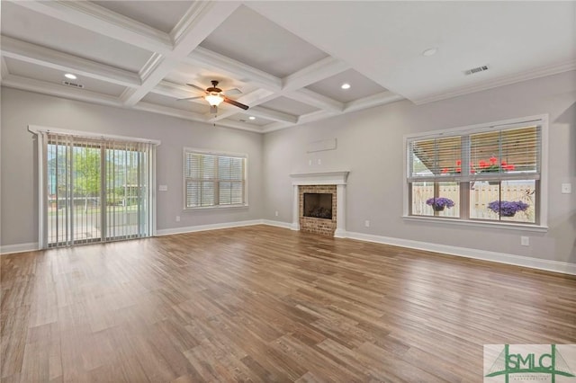 unfurnished living room with baseboards, visible vents, and a ceiling fan