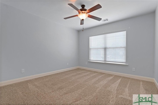 empty room with a ceiling fan, light carpet, baseboards, and visible vents