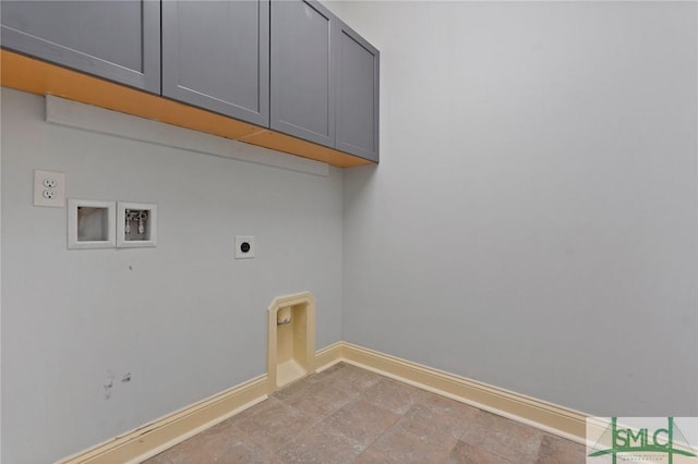 laundry room with baseboards, hookup for an electric dryer, cabinet space, and hookup for a washing machine