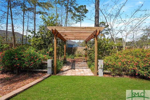 view of yard featuring a fenced backyard, a pergola, and a patio area