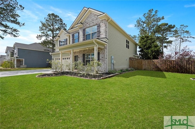view of front of home featuring a front yard, fence, a garage, and concrete driveway