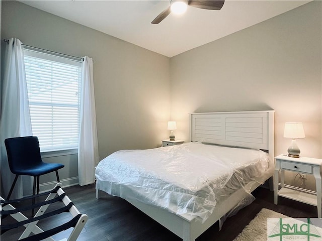 125 Long Creek Ln, Richmond Hill, GA 31324 - bedroom with dark wood-type flooring, baseboards, and a ceiling fan