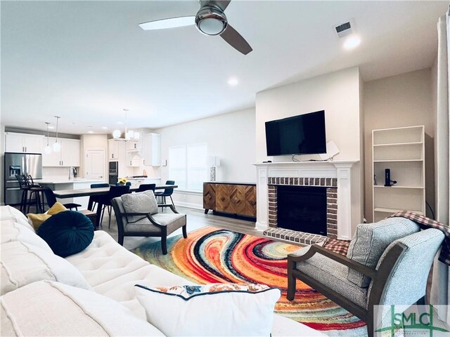 125 Long Creek Ln, Richmond Hill, GA 31324 - living area featuring ceiling fan, recessed lighting, light wood-style floors, and a fireplace