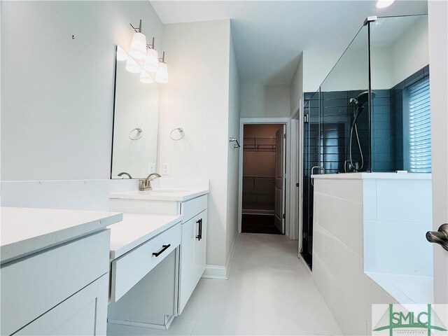 125 Long Creek Ln, Richmond Hill, GA 31324 - bathroom with walk in shower, vanity, a walk in closet, and baseboards
