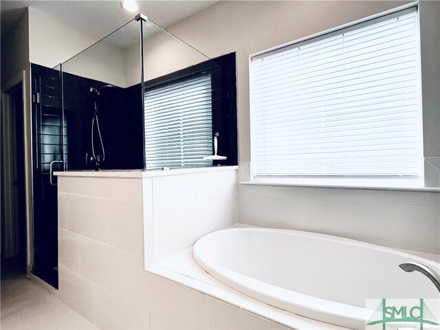 125 Long Creek Ln, Richmond Hill, GA 31324 - bathroom featuring a shower stall and a bath