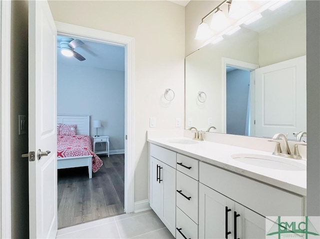 125 Long Creek Ln, Richmond Hill, GA 31324 - ensuite bathroom with double vanity, baseboards, and tile patterned floors