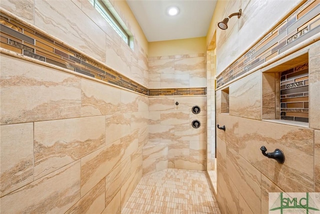 full bath with a tile shower