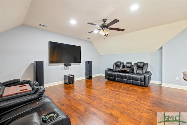 living area with visible vents, vaulted ceiling, wood finished floors, and ceiling fan