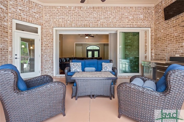 view of patio featuring an outdoor living space and a ceiling fan