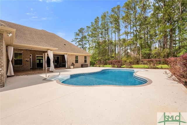 pool with a patio area