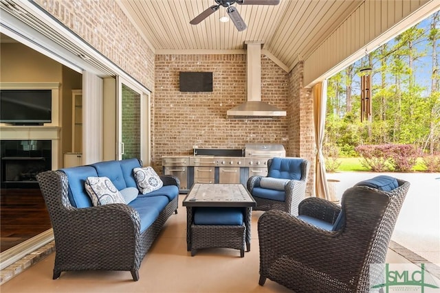 view of patio featuring an outdoor living space, ceiling fan, and area for grilling