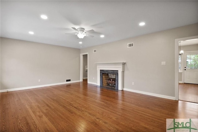 1517 E 52nd St, Savannah, GA 31404 - unfurnished living room with recessed lighting, a fireplace with flush hearth, ceiling fan, and wood finished floors