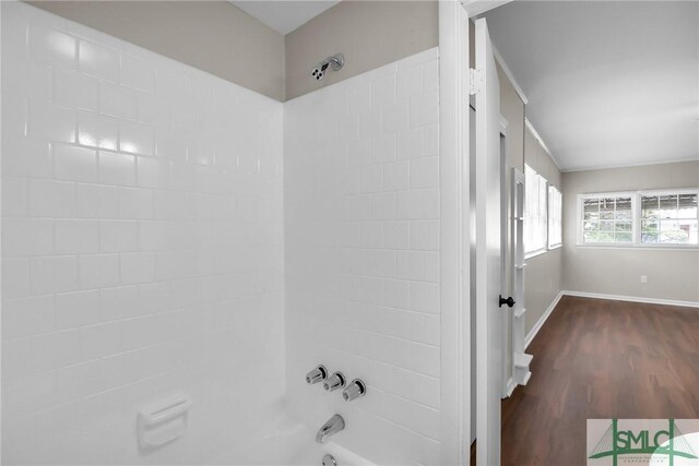 1517 E 52nd St, Savannah, GA 31404 - bathroom featuring bathing tub / shower combination, wood finished floors, and baseboards