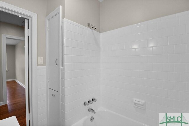 1517 E 52nd St, Savannah, GA 31404 - full bath with tub / shower combination, wood finished floors, and baseboards