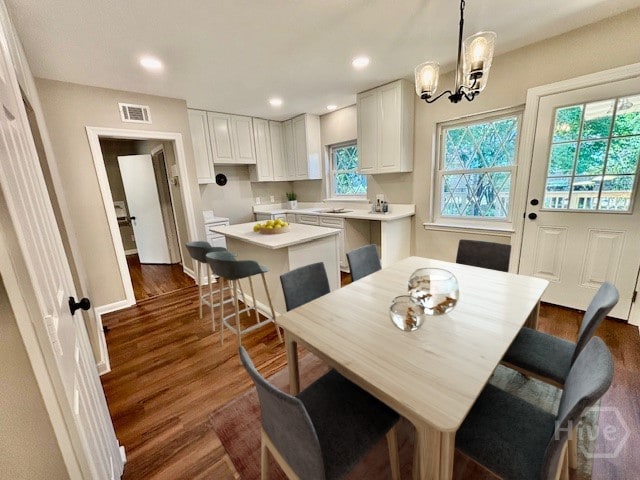 1517 E 52nd St, Savannah, GA 31404 - dining area with dark wood-style flooring, recessed lighting, and a chandelier