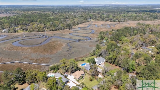 aerial view featuring a wooded view