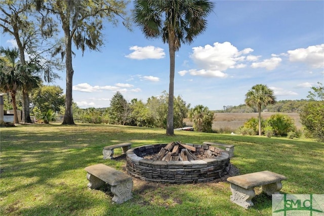 view of yard with a fire pit