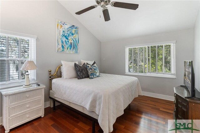 1000 Sea Island Rd Unit 56, Saint Simons Island, GA 31522 - bedroom with vaulted ceiling, multiple windows, dark wood finished floors, and a ceiling fan