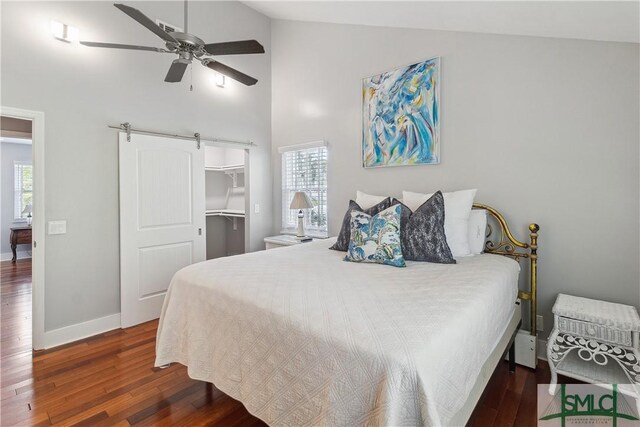 1000 Sea Island Rd Unit 56, Saint Simons Island, GA 31522 - bedroom featuring wood finished floors, high vaulted ceiling, a barn door, multiple windows, and a ceiling fan