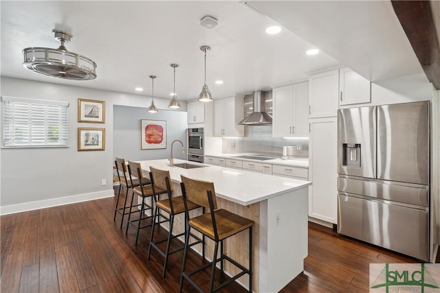 1000 Sea Island Rd Unit 56, Saint Simons Island, GA 31522 - kitchen featuring stainless steel fridge with ice dispenser, wall chimney range hood, an island with sink, a breakfast bar, and light countertops