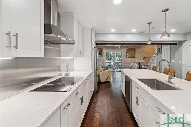 1000 Sea Island Rd Unit 56, Saint Simons Island, GA 31522 - kitchen featuring wall chimney range hood, appliances with stainless steel finishes, open floor plan, recessed lighting, and dark wood-style floors