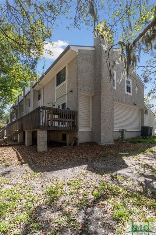 1000 Sea Island Rd Unit 56, Saint Simons Island, GA 31522 - rear view of house with a deck and stucco siding