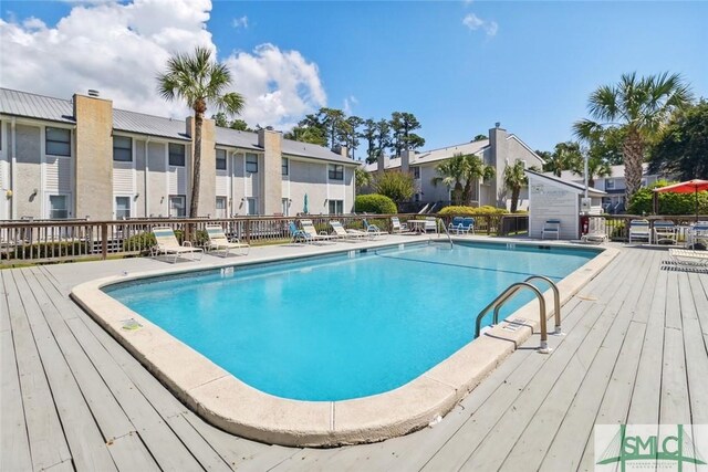 1000 Sea Island Rd Unit 56, Saint Simons Island, GA 31522 - community pool with a wooden deck and a residential view