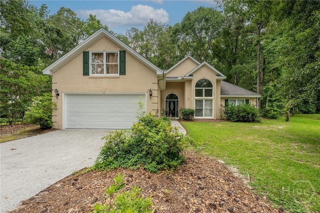 8 Crows Nest Pt, Savannah, GA 31419 - view of front of home featuring asphalt driveway, stucco siding, a front yard, and an attached garage