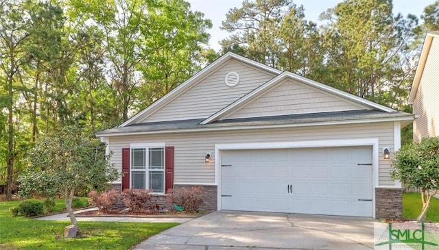 view of front of home featuring stone siding, concrete driveway, and an attached garage
