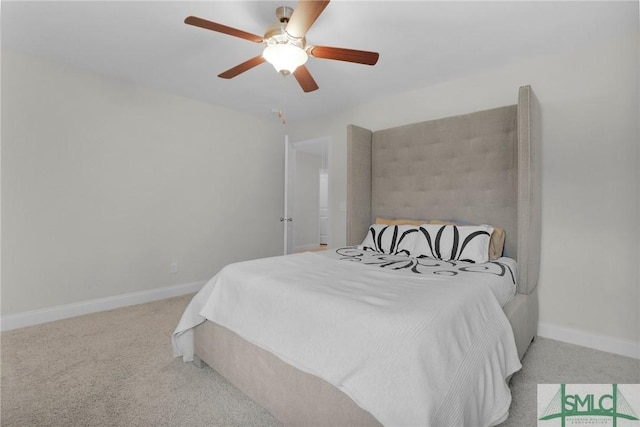 bedroom featuring baseboards, a ceiling fan, and light carpet