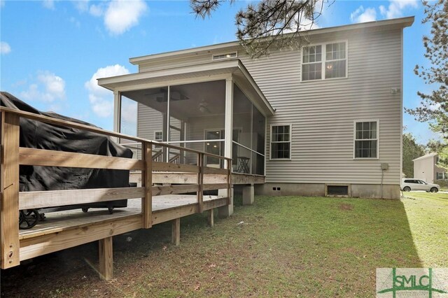 back of property featuring a sunroom and a yard