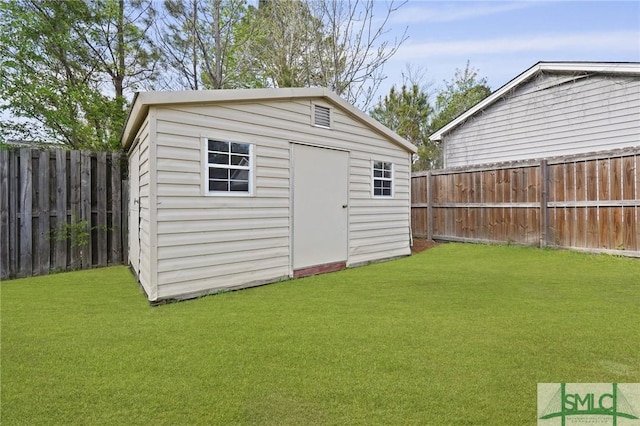 view of shed featuring a fenced backyard