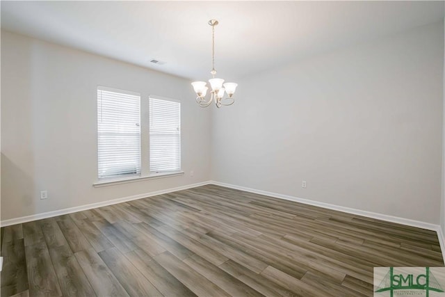 135 Sessile Oak Dr, Savannah, GA 31419 - unfurnished room with visible vents, baseboards, a chandelier, and dark wood finished floors