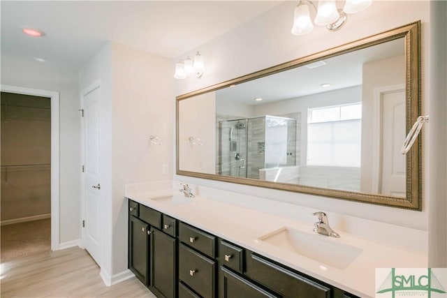 135 Sessile Oak Dr, Savannah, GA 31419 - bathroom featuring baseboards, double vanity, a sink, and a shower stall