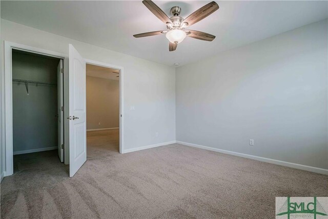 135 Sessile Oak Dr, Savannah, GA 31419 - unfurnished bedroom with baseboards, a walk in closet, a closet, and carpet
