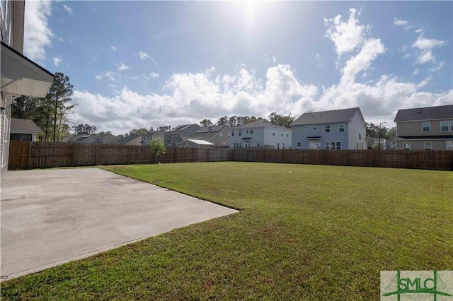 135 Sessile Oak Dr, Savannah, GA 31419 - view of yard featuring a residential view, a fenced backyard, and a patio area
