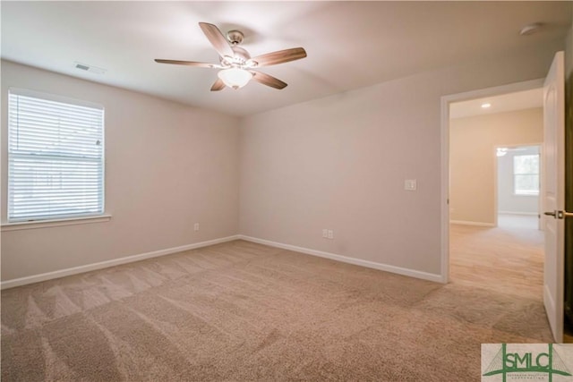 135 Sessile Oak Dr, Savannah, GA 31419 - empty room featuring light carpet, baseboards, visible vents, and a ceiling fan